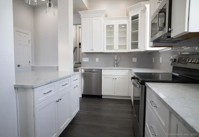 a kitchen with a sink and cabinets