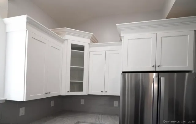 a view of an empty room with entryway