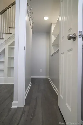 a view of a hallway with stairs