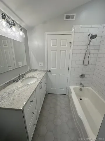 a bathroom with a bathtub