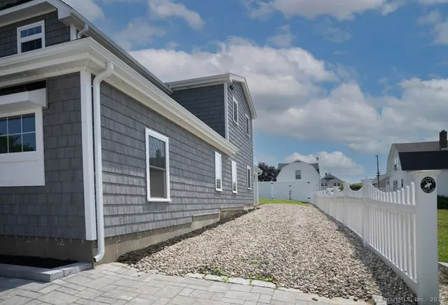 a picture of a brick house with many windows