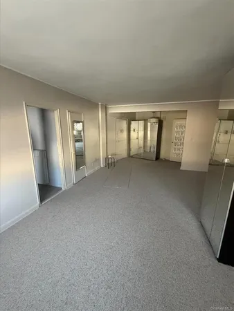 a view of empty room with windows