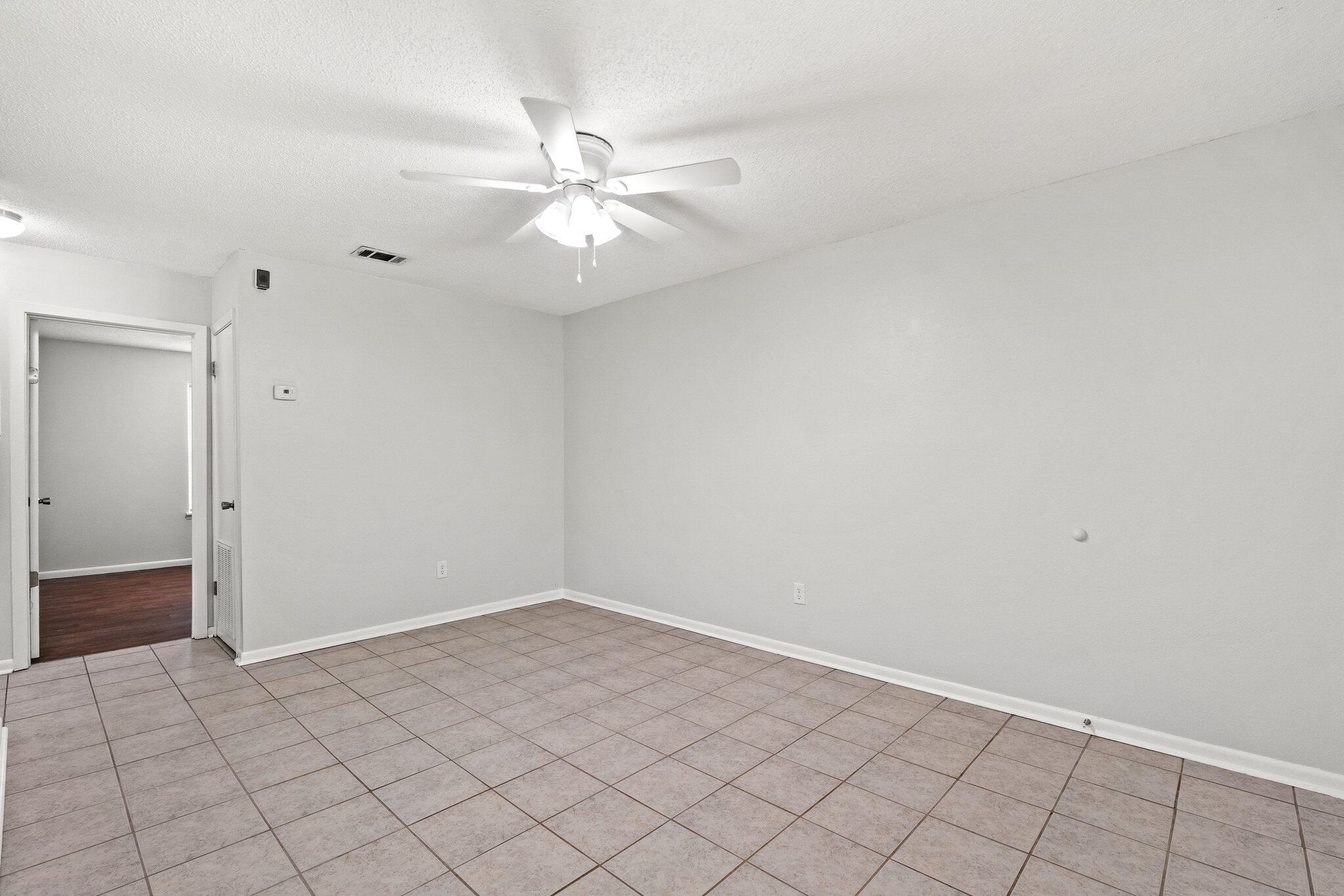 248 4 Mile Road, Unit G Freeport, FL 32439 - Photo 6 of 19 wooden floor in an empty room