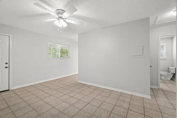 a view of an empty room and window