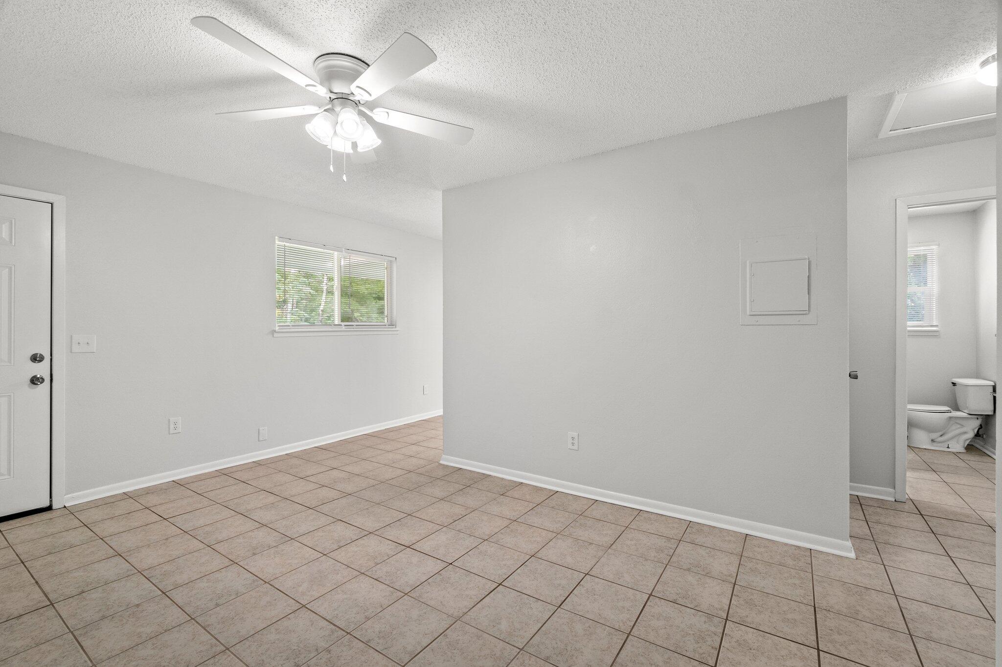 248 4 Mile Road, Unit G Freeport, FL 32439 - Photo 7 of 19 a view of an empty room and window