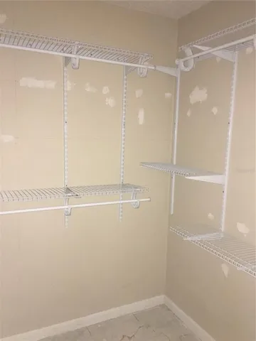 an empty room with a bench