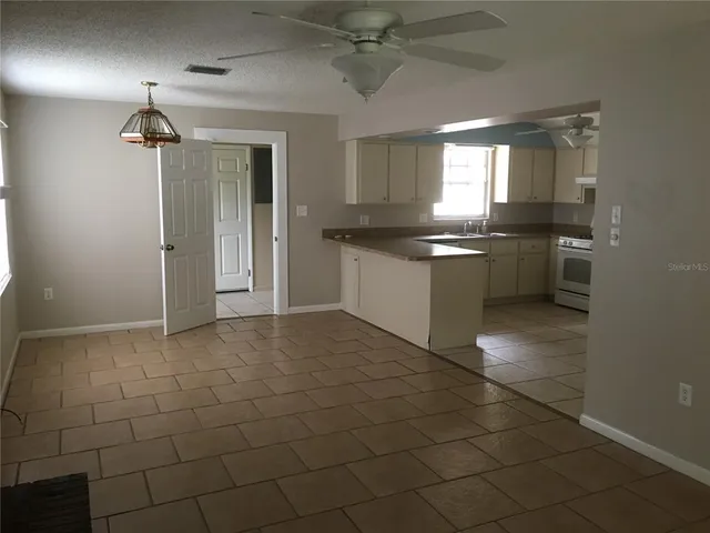 a kitchen with a sink cabinets and appliances