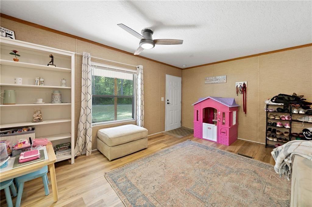 1575 Davis Road West Fairmount, GA 30139 - Photo 12 of 49 a bedroom with furniture and a bed