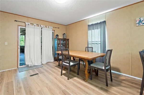 a view of a livingroom with furniture and wooden floor