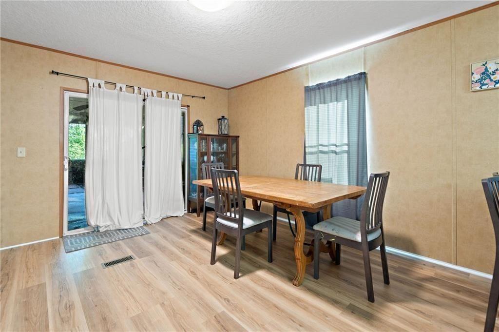1575 Davis Road West Fairmount, GA 30139 - Photo 18 of 49 a view of a livingroom with furniture and wooden floor