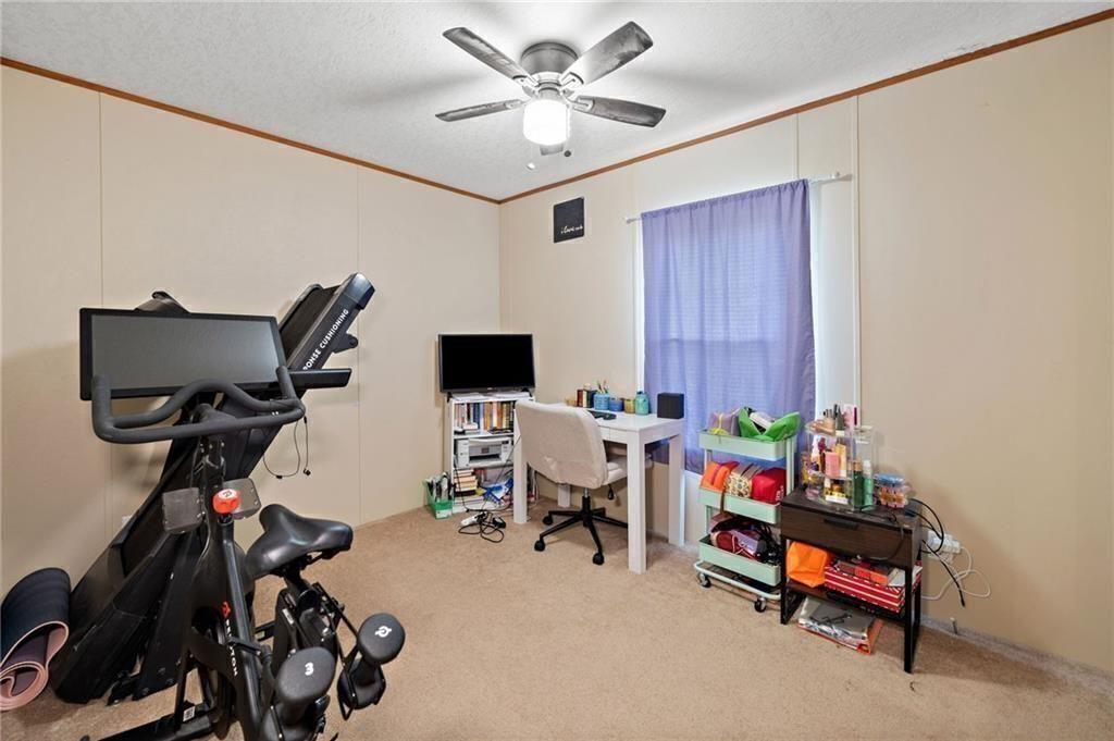 1575 Davis Road West Fairmount, GA 30139 - Photo 22 of 49 a view of a workspace with furniture and a window