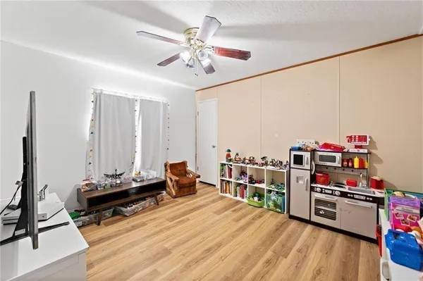 a bedroom with furniture and a wooden floor