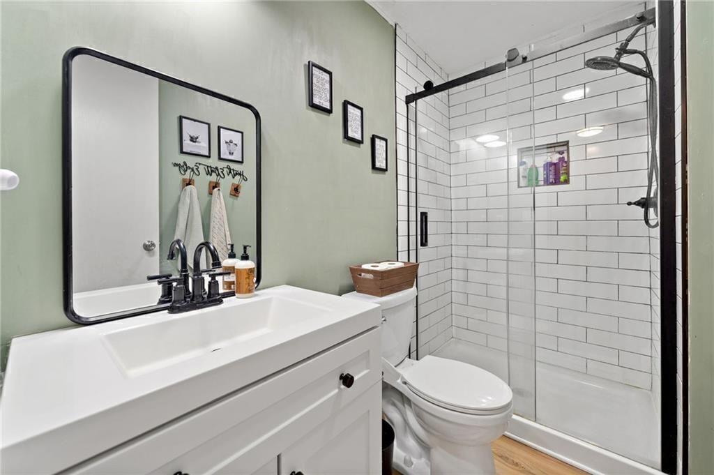 1575 Davis Road West Fairmount, GA 30139 - Photo 24 of 49 a bathroom with a sink toilet and shower