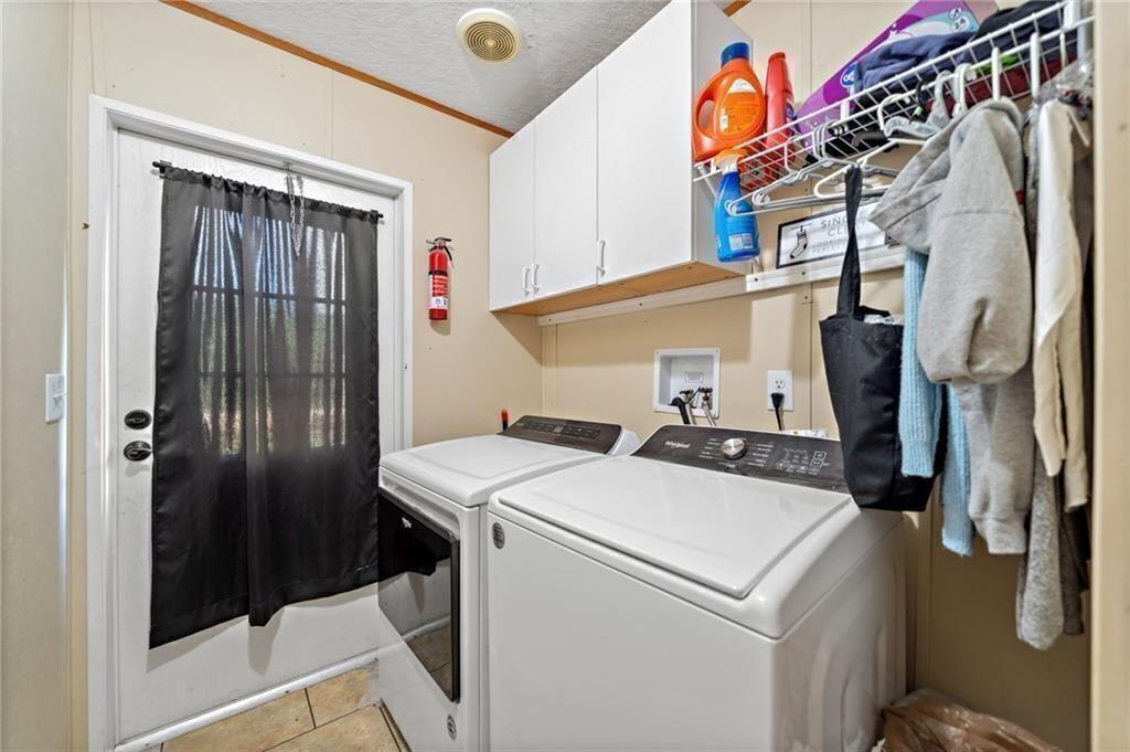 1575 Davis Road West Fairmount, GA 30139 - Photo 27 of 49 a utility room with dryer and washer