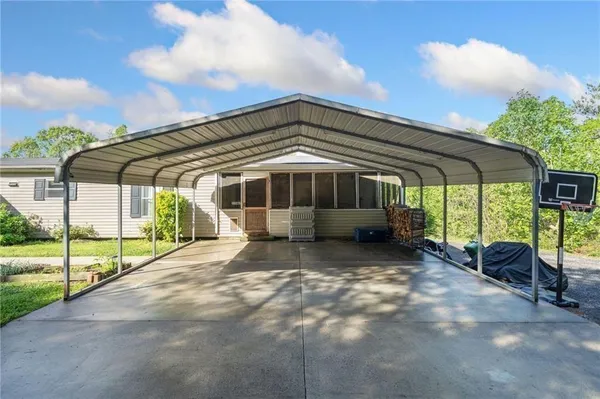 a view of a house with backyard and balcony