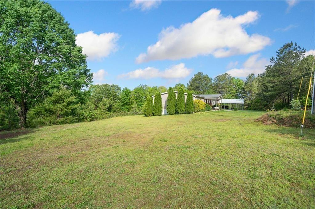 1575 Davis Road West Fairmount, GA 30139 - Photo 38 of 49 a view of a yard with a trampoline