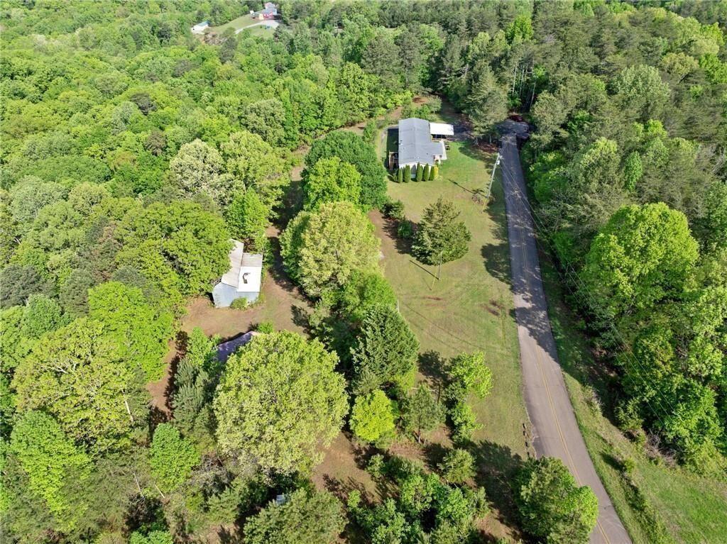 1575 Davis Road West Fairmount, GA 30139 - Photo 47 of 49 an aerial view of residential house with outdoor space and trees all around