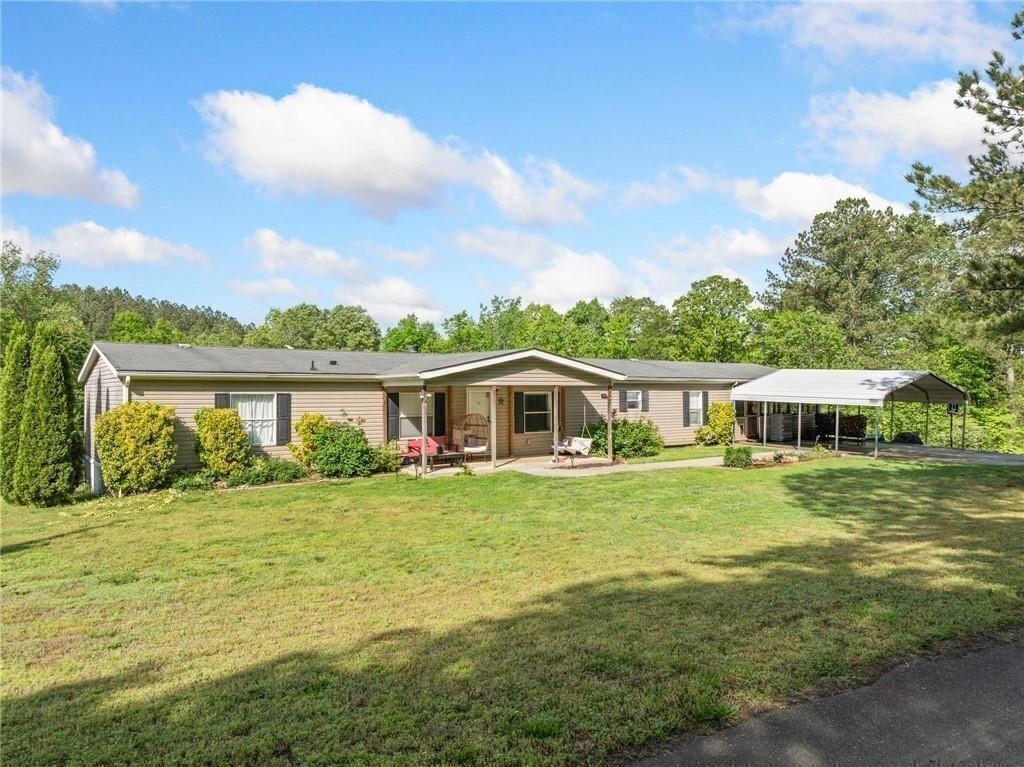 1575 Davis Road West Fairmount, GA 30139 - Photo 7 of 49 a front view of a house with a yard