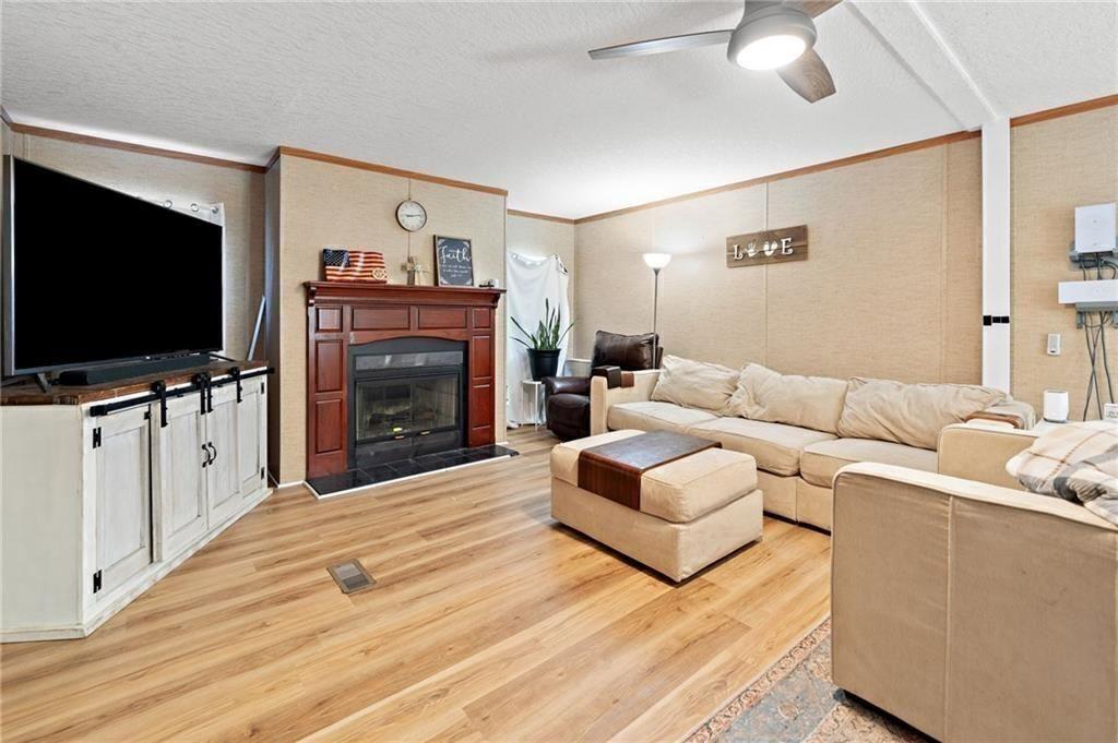 1575 Davis Road West Fairmount, GA 30139 - Photo 10 of 49 a living room with furniture and a flat screen tv