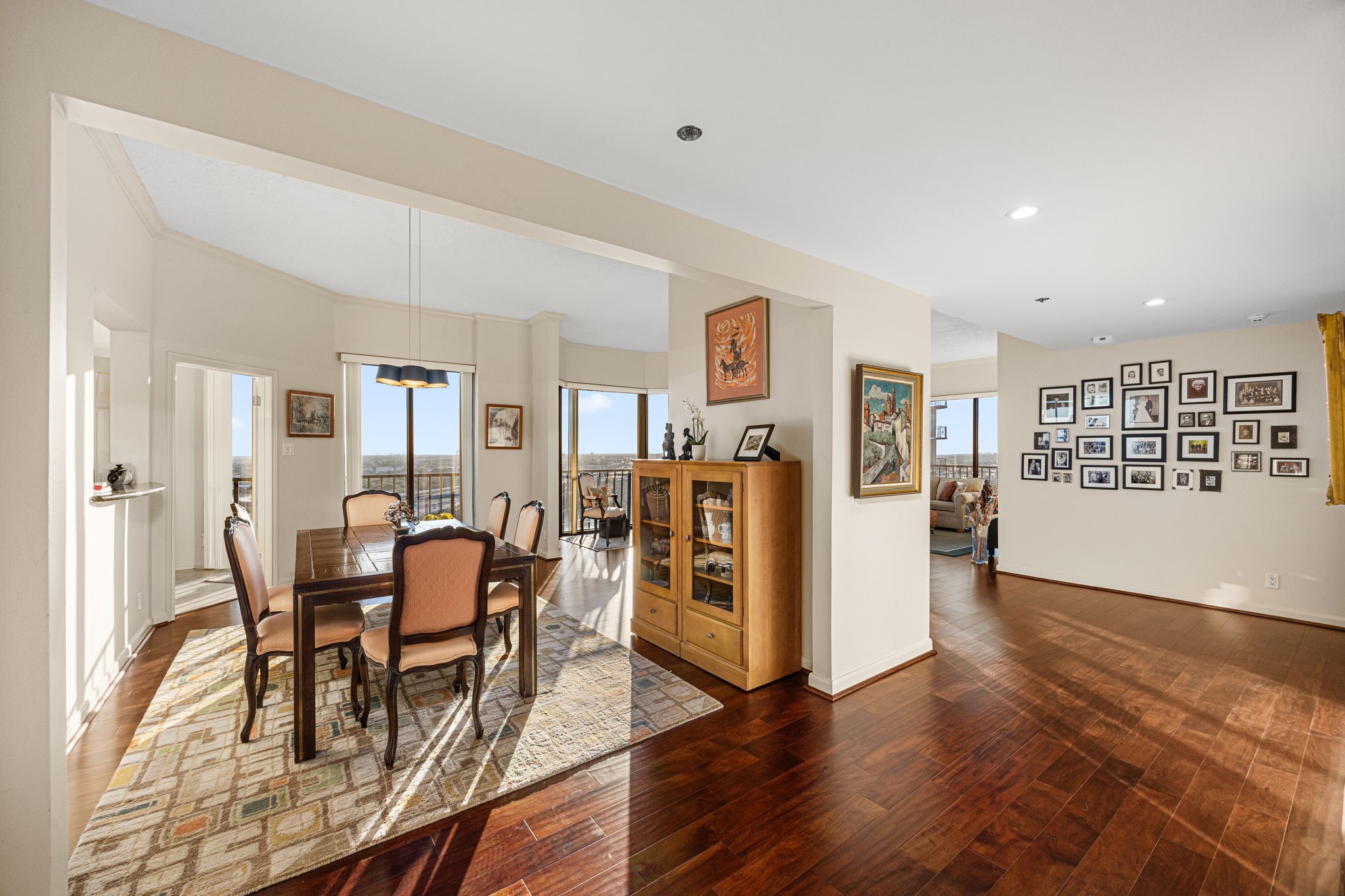 3350 McCue Road, Unit 2302 Houston, TX 77056 - Photo 5 of 35 The large and welcoming entry is open to both dining and living, and greets you will natural light from the wall of windows ahead.