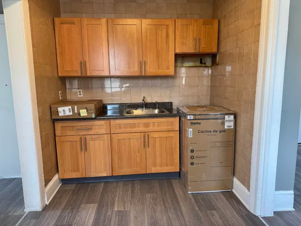 a kitchen with a sink and cabinets