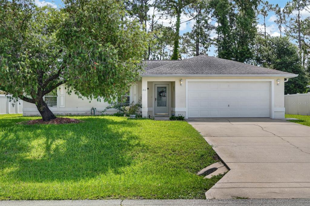 80 Roxboro Drive Palm Coast, FL 32164 - Photo 30 of 39 a view of outdoor space yard and garage