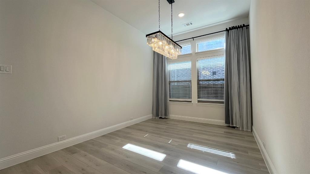 5304 Babcock Road McKinney, TX 75071 - Photo 10 of 27 en empty room with a mirror and a fan