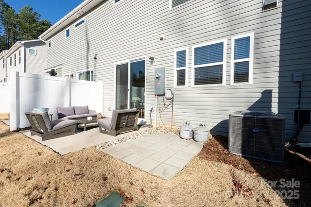 a view of a dinning table and chairs in the patio
