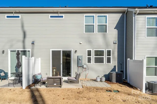 a view of a house with snow on the road