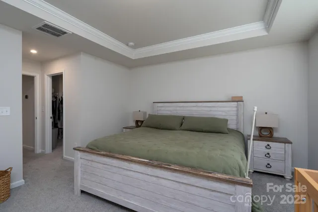 a bedroom with a bed and a tv