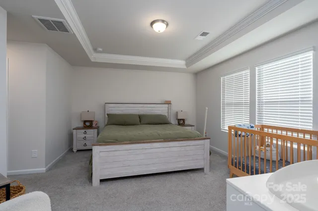 a bedroom with a bed and a table