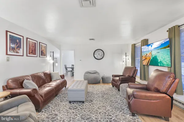 a view of a dining room with furniture and window