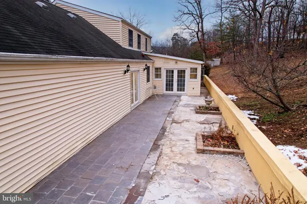 a bedroom with a large bed and a couch