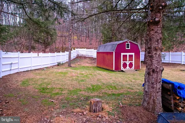 an aerial view of a house with outdoor space