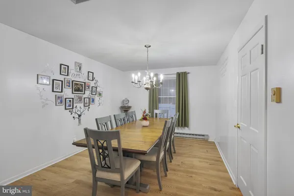 a kitchen with granite countertop white cabinets and stainless steel appliances