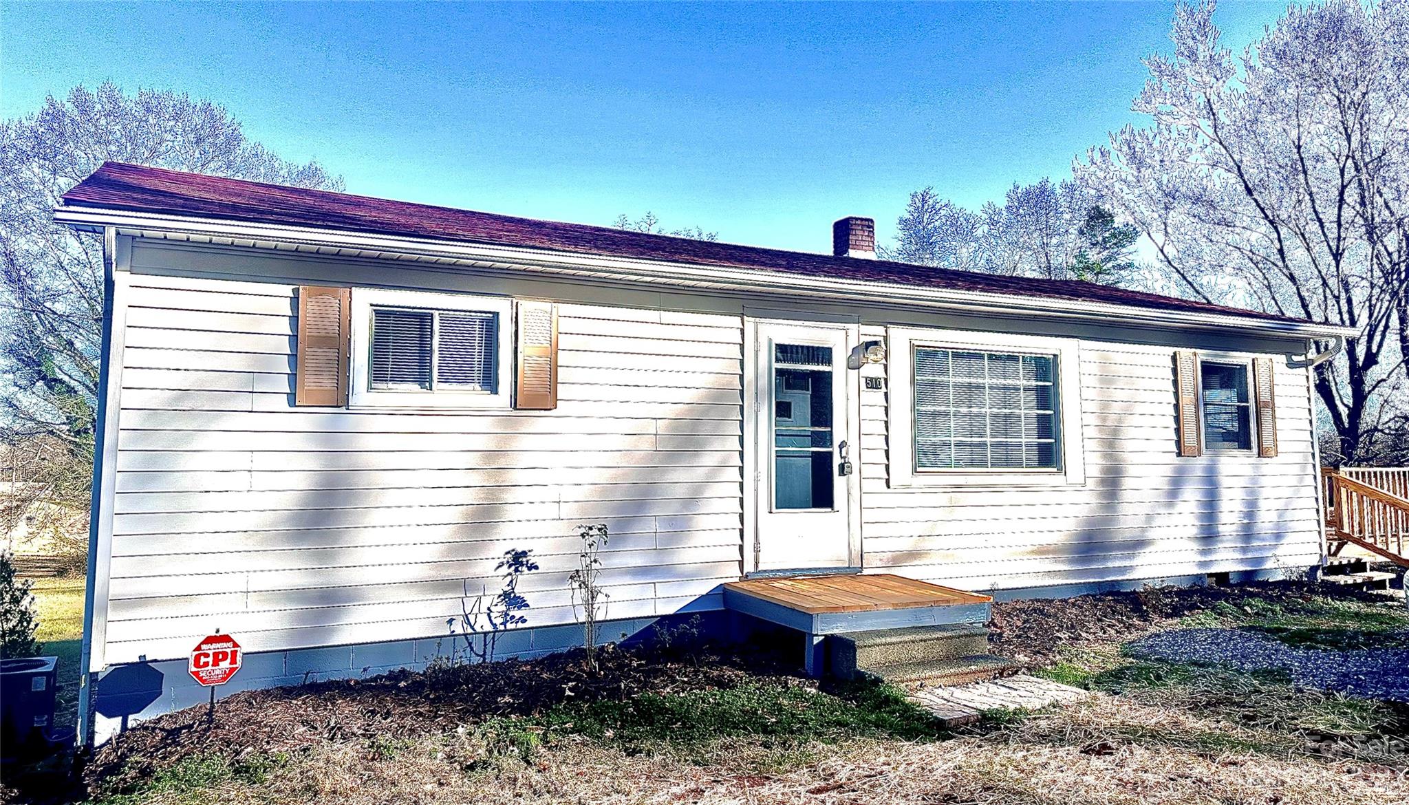 510 Tabor Road Olin, NC 28660 - Photo 1 of 16 a front view of a house with a yard