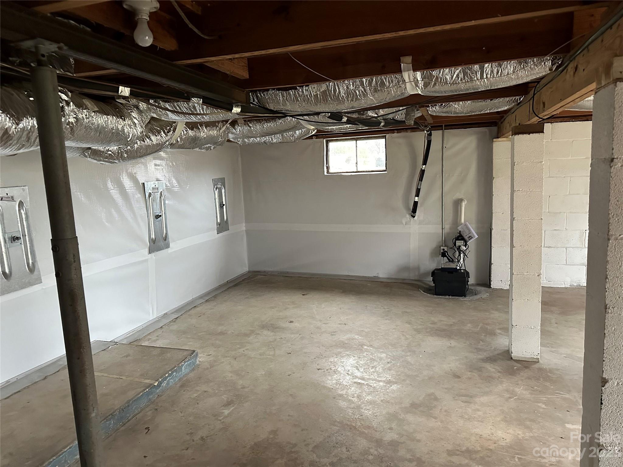 510 Tabor Road Olin, NC 28660 - Photo 14 of 16 a view of a big room with chandelier