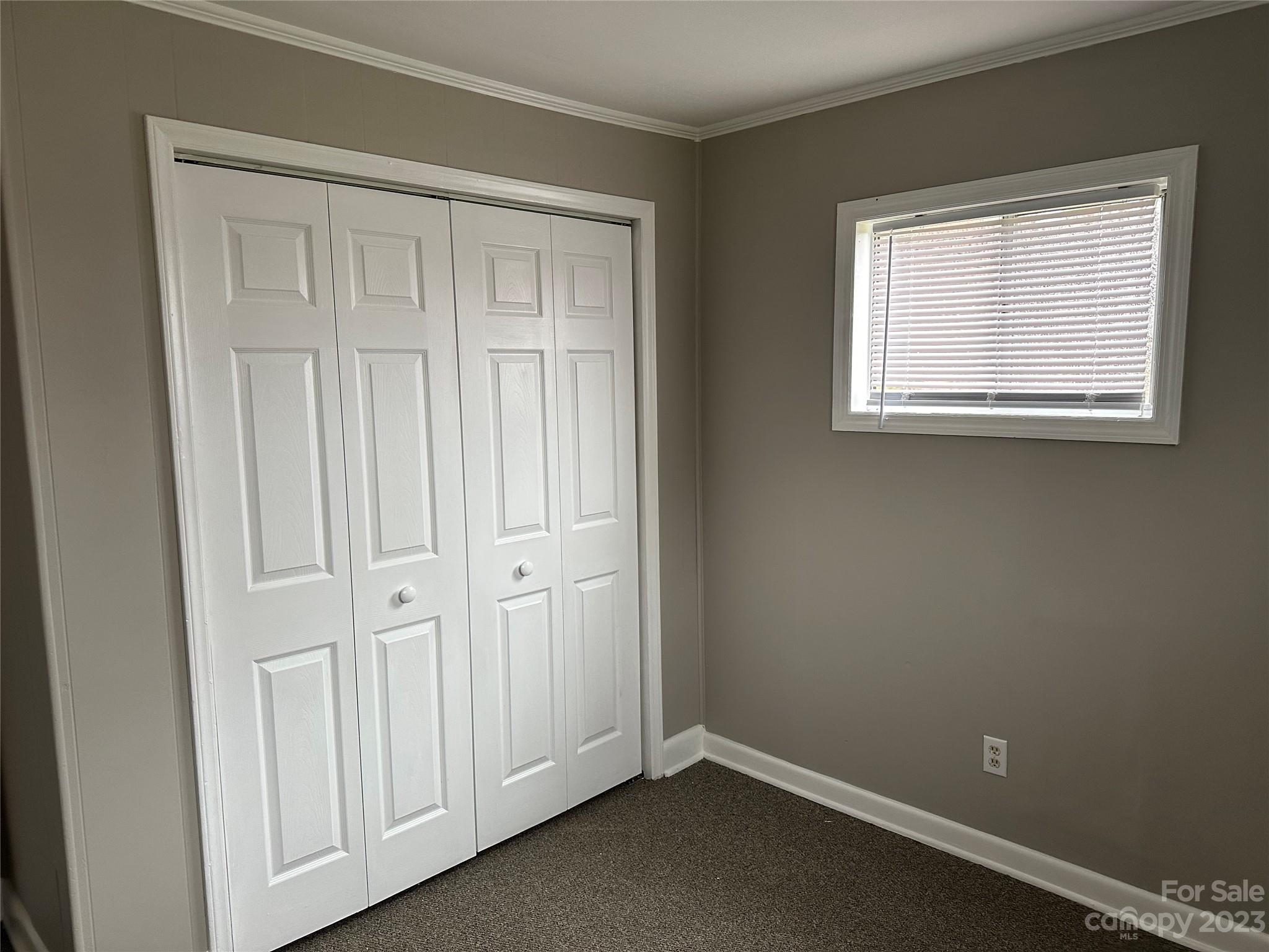 510 Tabor Road Olin, NC 28660 - Photo 7 of 16 an empty room with windows