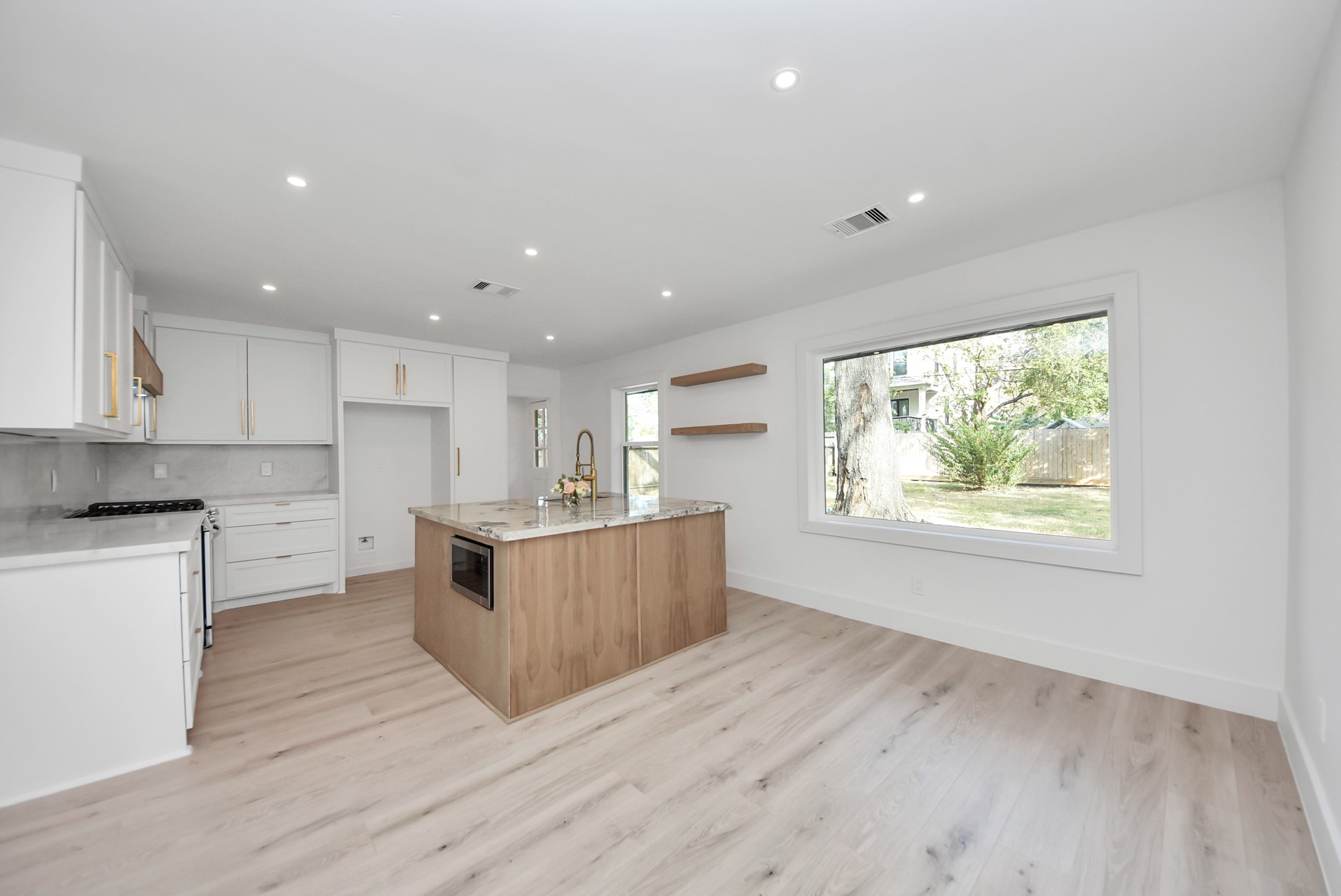 2318 Hialeah Drive Houston, TX 77018 - Photo 1 of 42 Open concept kitchen and dining combo with huge no grid window over looking the backyard.