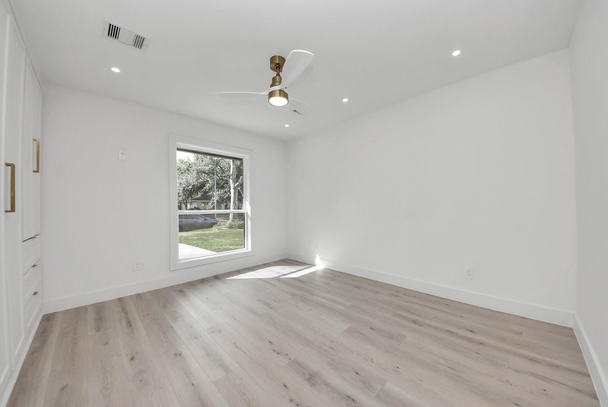 2318 Hialeah Drive Houston, TX 77018 - Photo 23 of 42 Primary bedroom offers built-in custom cabinets and drawers and a remote controlled ceiling fan