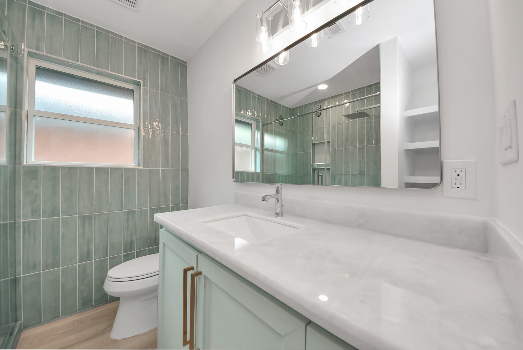 2318 Hialeah Drive Houston, TX 77018 - Photo 32 of 42 Full guest bath offers a shower with sleek and shiny tile, glass sliding door and quartzite countertop