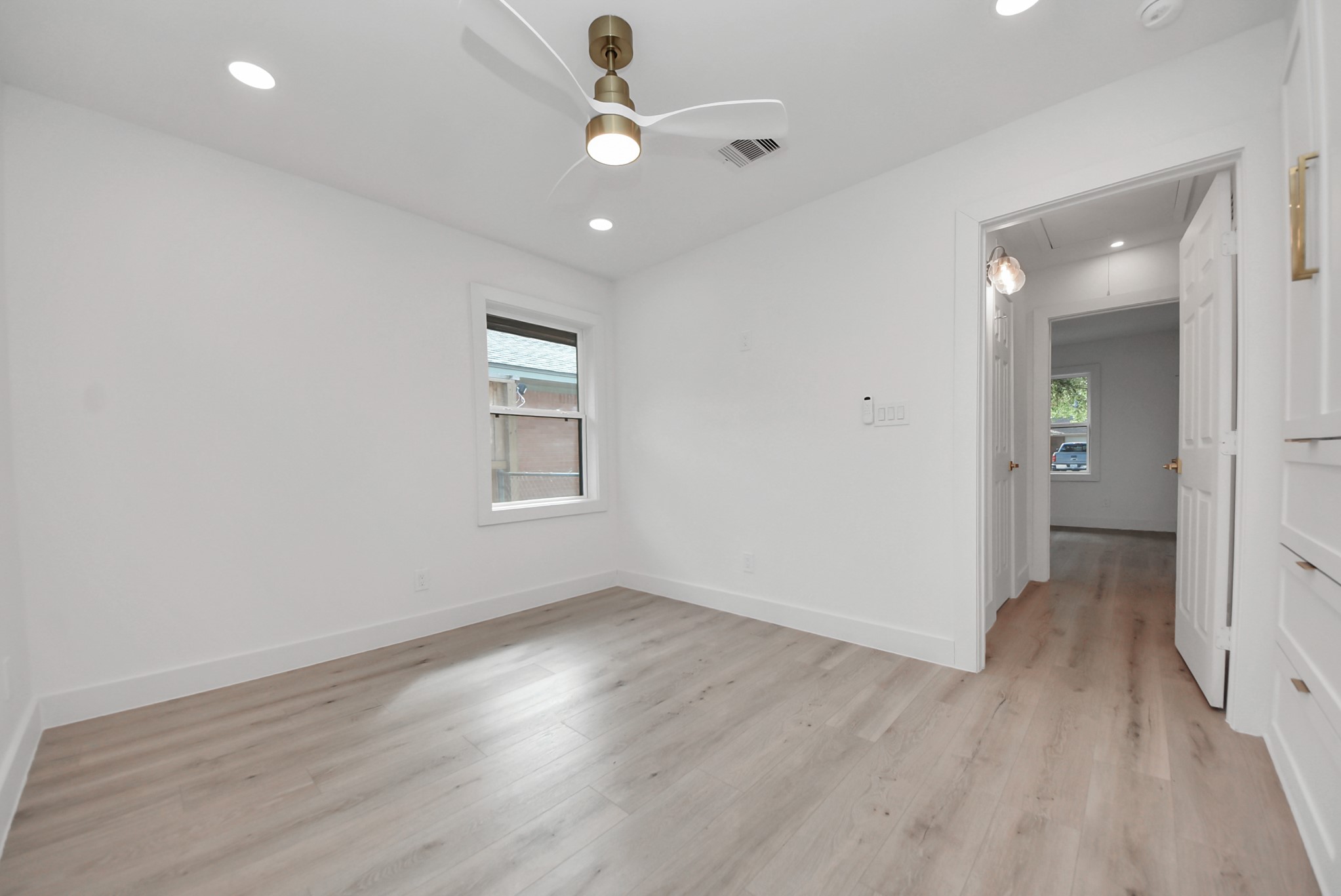 2318 Hialeah Drive Houston, TX 77018 - Photo 37 of 42 view from back bedroom looking towards the hall with full bath on the left and laundry nook on the right