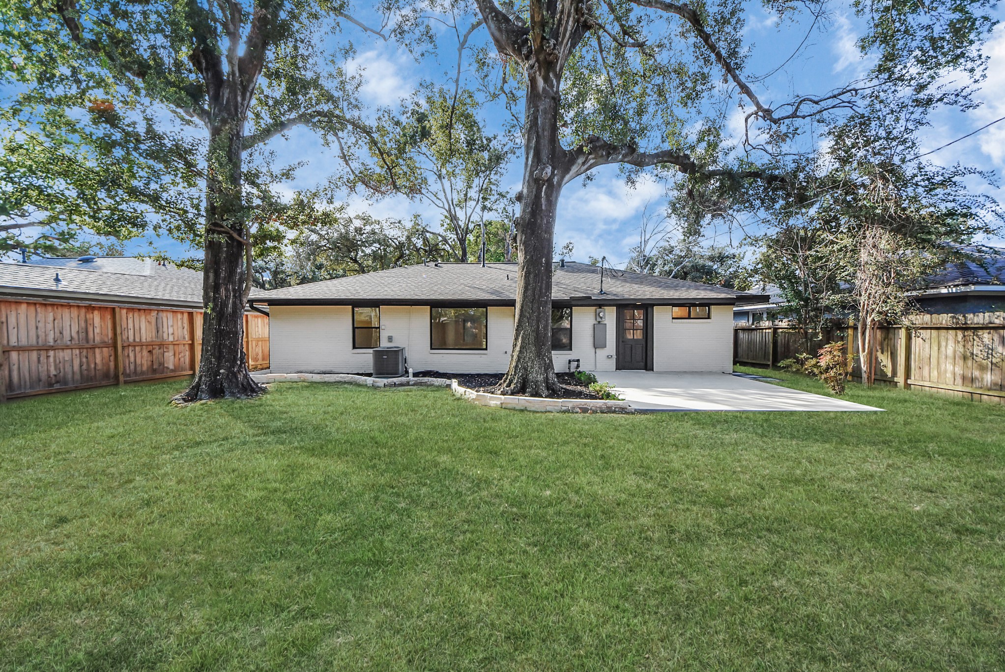 2318 Hialeah Drive Houston, TX 77018 - Photo 6 of 42 Backyard offers plenty space to make your own with new wood fencing. UPDATE! The right tree in this photo has been removed and stump grinded, adding more space for landscaping.
