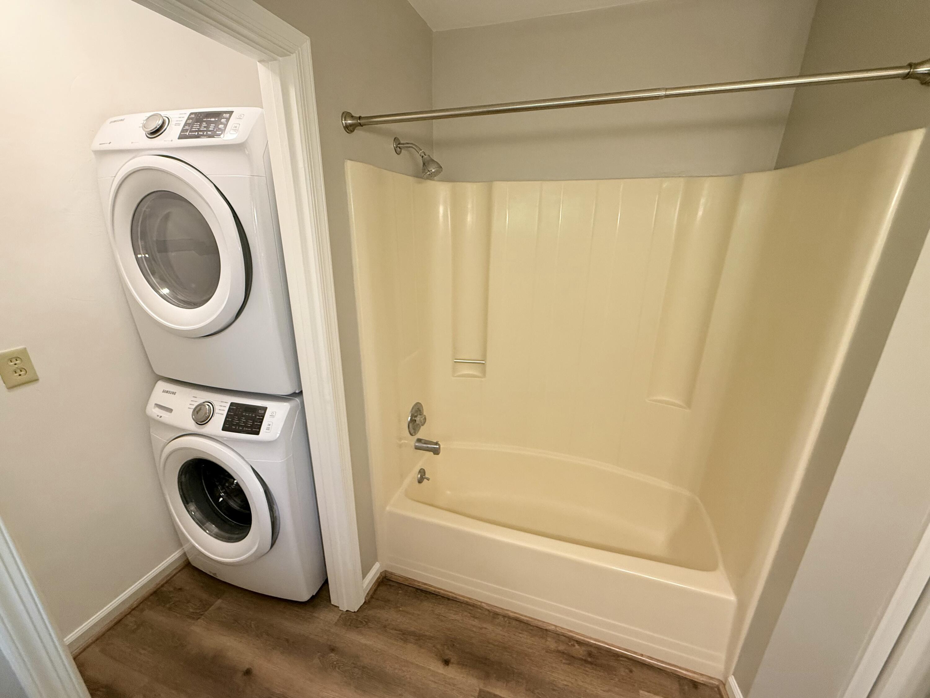 2317 Broadway Avenue Southwest, Unit E Roanoke, VA 24014 - Photo 12 of 20 a bathroom with a sink a washer and dryer