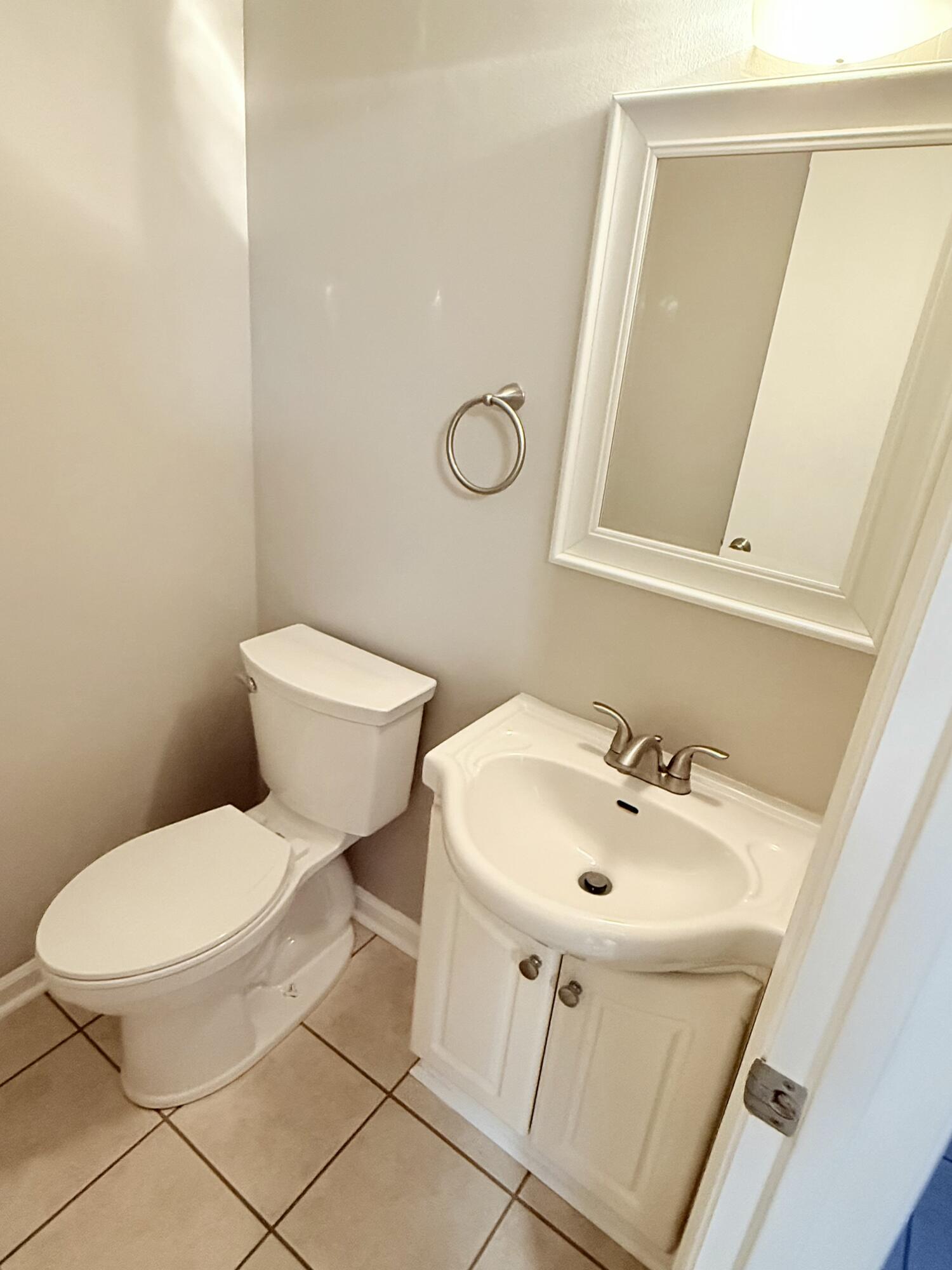 2317 Broadway Avenue Southwest, Unit E Roanoke, VA 24014 - Photo 19 of 20 a white toilet sitting next to a bathroom sink