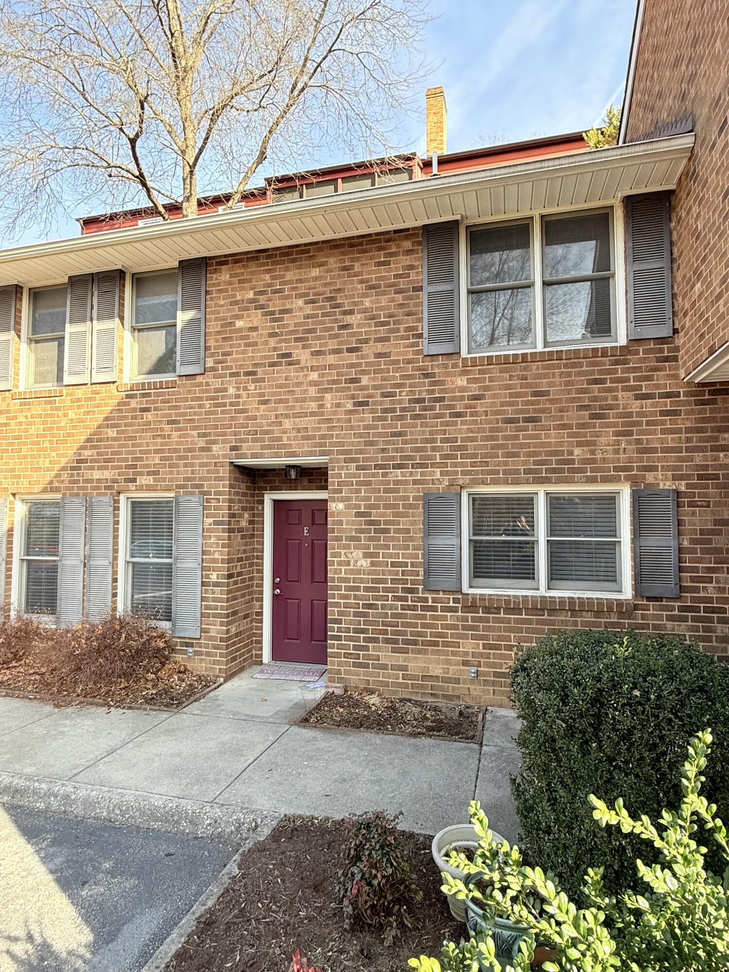 2317 Broadway Avenue Southwest, Unit E Roanoke, VA 24014 - Photo 2 of 20 a front view of a house with a yard