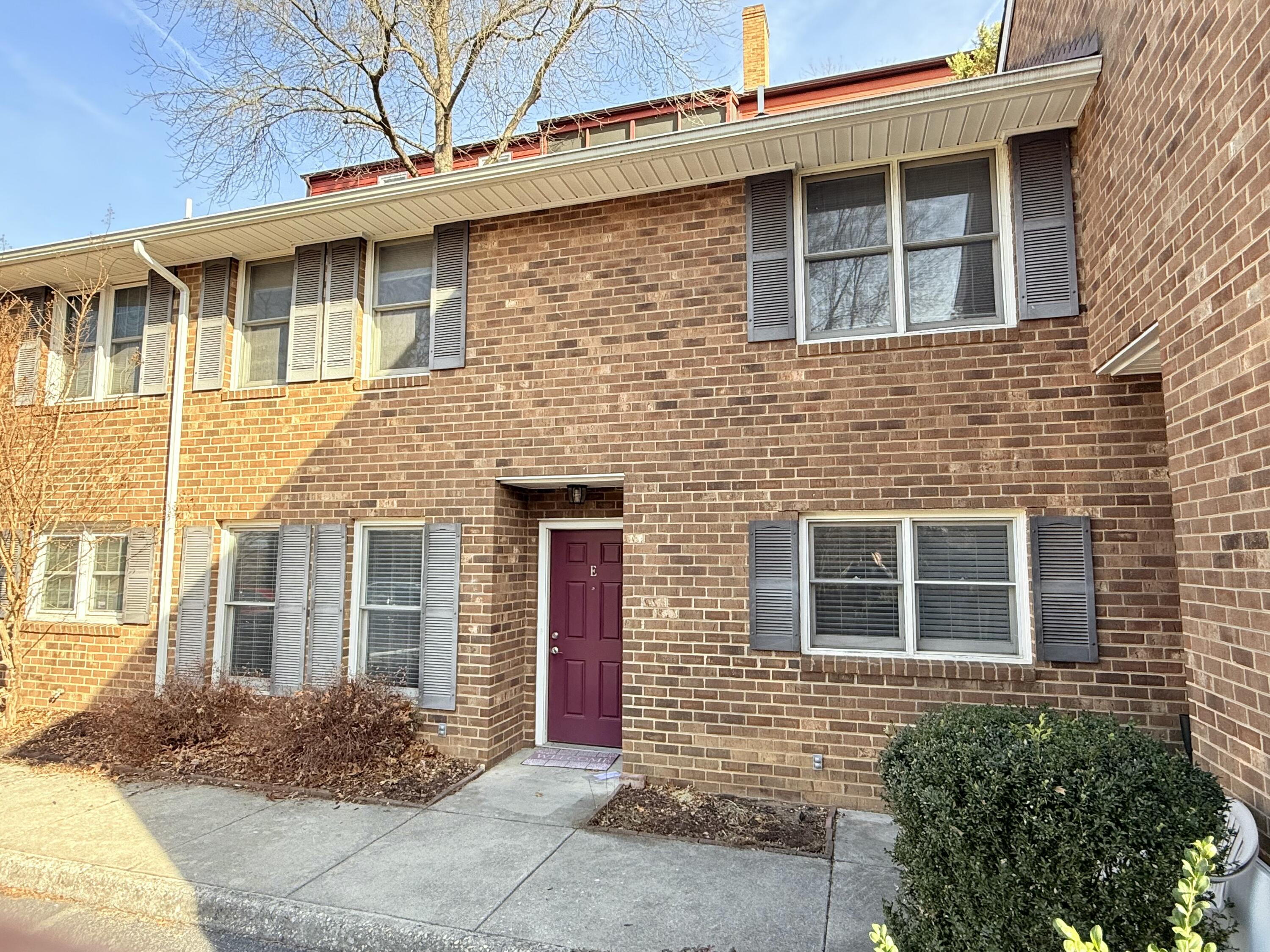 2317 Broadway Avenue Southwest, Unit E Roanoke, VA 24014 - Photo 3 of 20 a front view of a house with a yard