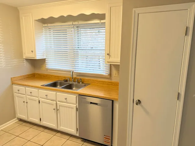 a kitchen with a sink and cabinets