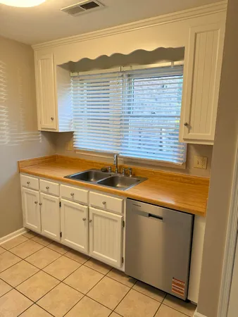 a kitchen with a sink and cabinets