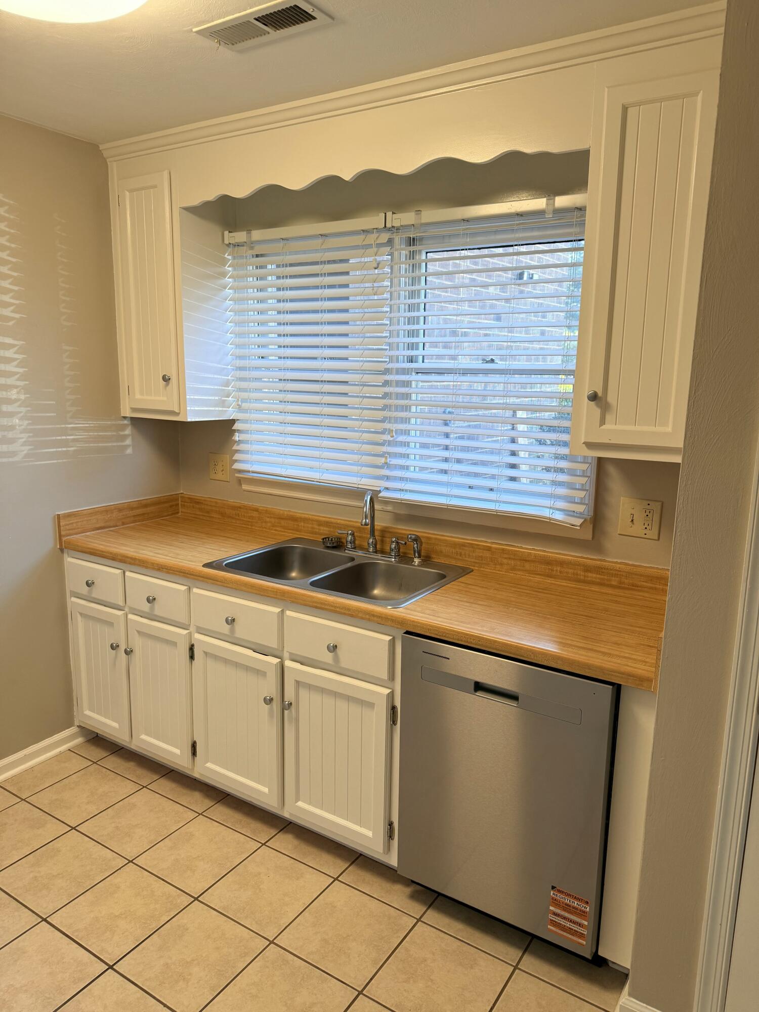 2317 Broadway Avenue Southwest, Unit E Roanoke, VA 24014 - Photo 5 of 20 a kitchen with a sink and cabinets